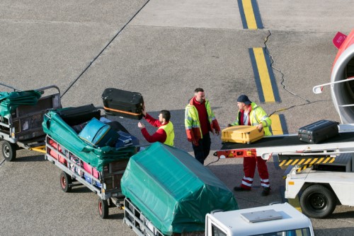 Airport worker caught on camera stealing from passenger's luggage