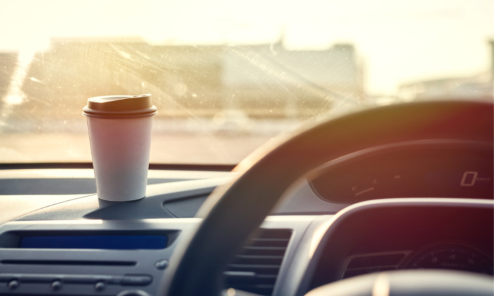 Tribunal finds that spilling tea while stopped at a red light is not an automobile accident