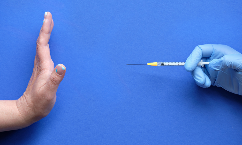 Unpaid leave with benefits for vaccine non-compliance not constructive dismissal: BC court
