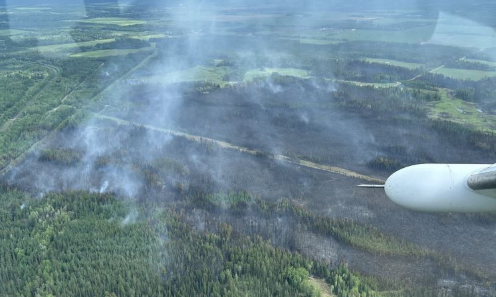 Employers relocate workers as Alberta wildfire destroys at least 27 structures
