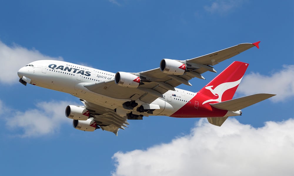 Qantas posts $1.08 billion half-year loss