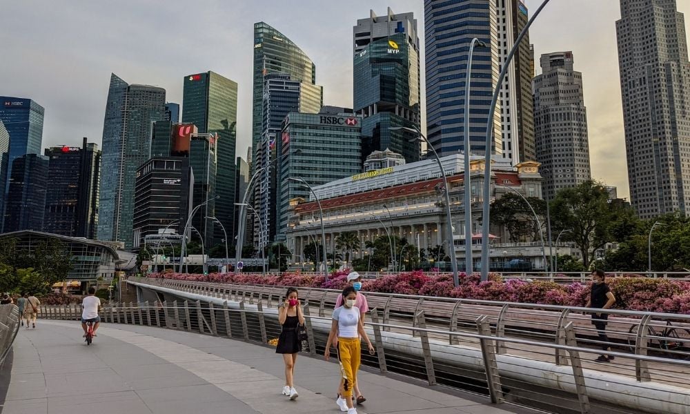 Singapore tightens COVID curbs, makes WFH 'default'