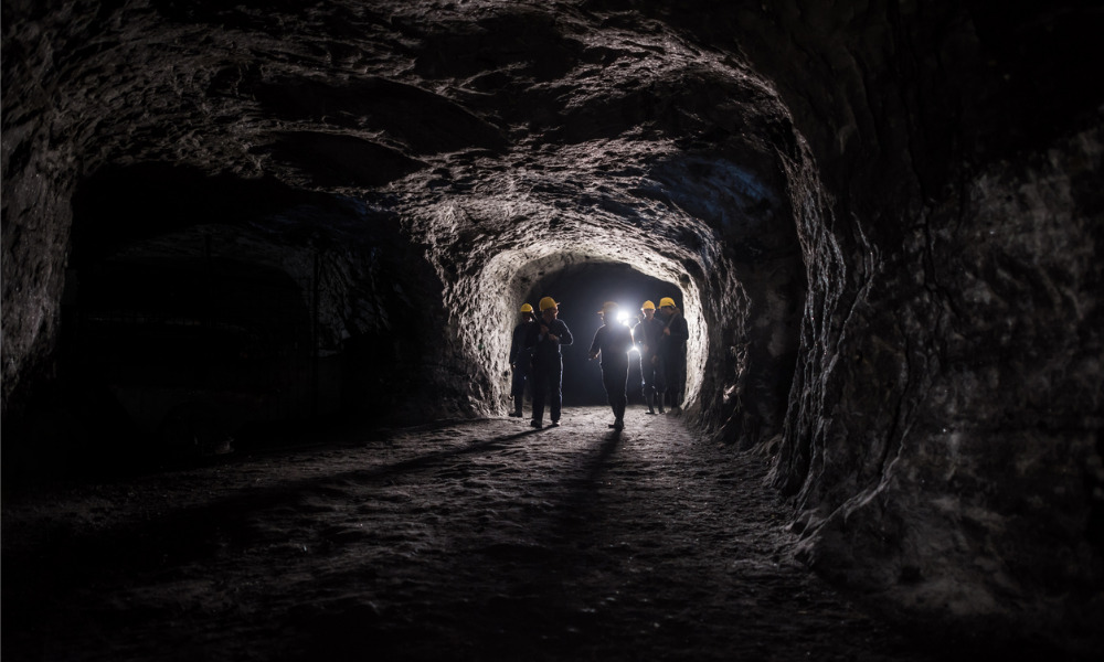 Search party close to workers trapped in flooded mine