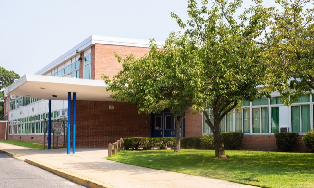 Two high school staff and a student hurt in stabbing incident