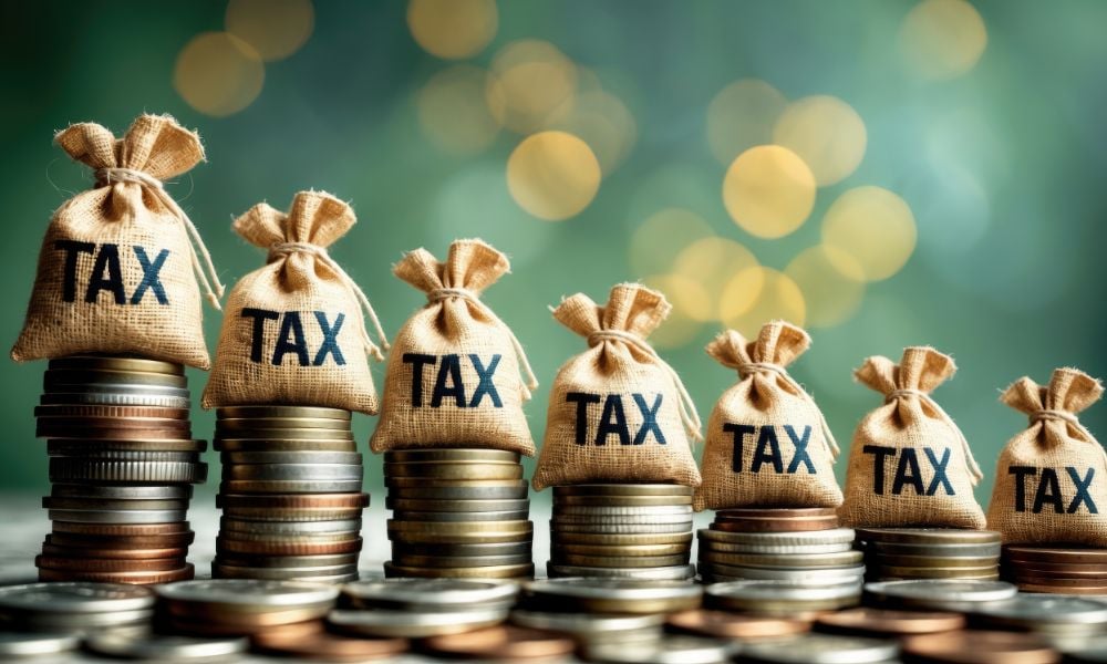 How much of Canada's tax burden is shouldered by the highest earners?
