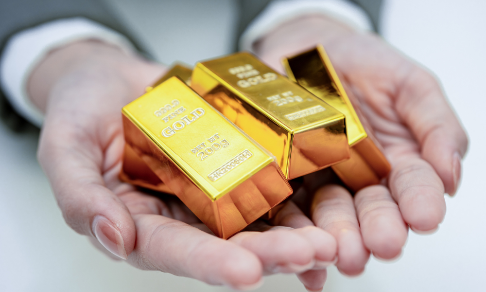 Gold climbs on weak US jobs data, retreats as profit-taking kicks in