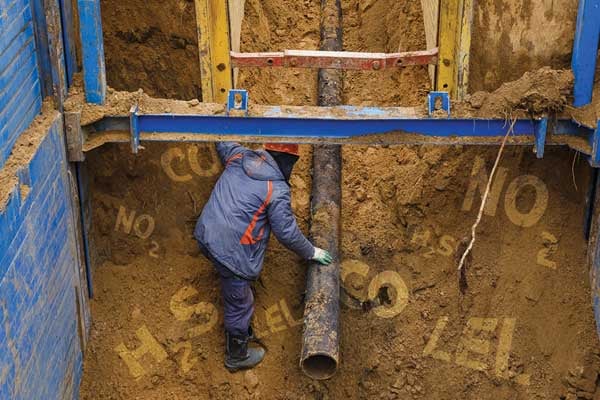 Construction worker dies after being trapped in a deep trench