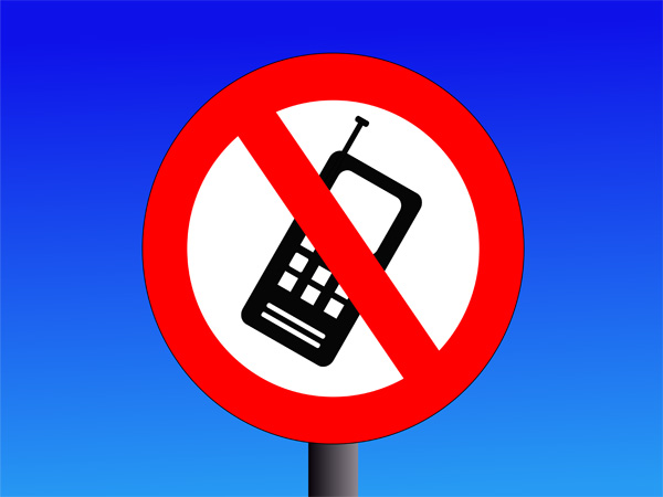 Ban on hand-held devices now Ontario law
