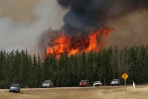 Oil sands producers evacuating workers as wildfire shifts north