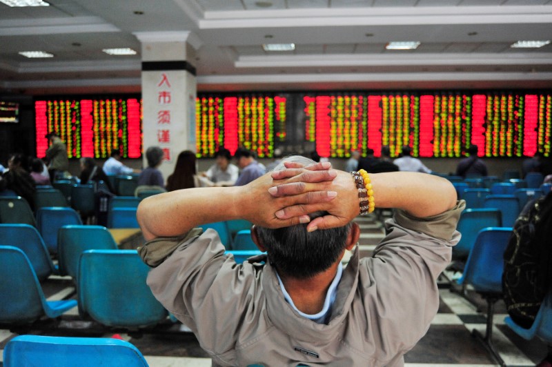 In China, some firms ask workers to buy shares in a bid to raise stock price