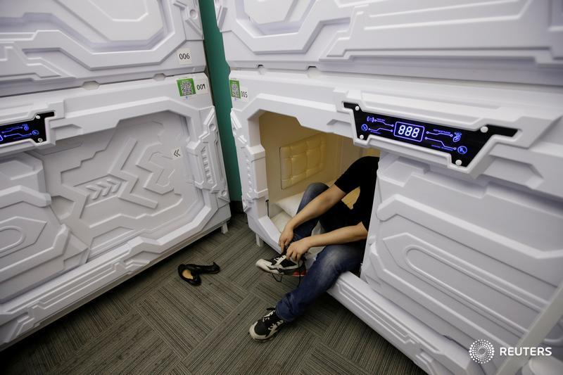 Eyeing sleepy office workers, China's 'sharing economy' opens nap capsules