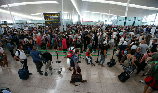 Air passengers face long delays in Barcelona as security staff strike