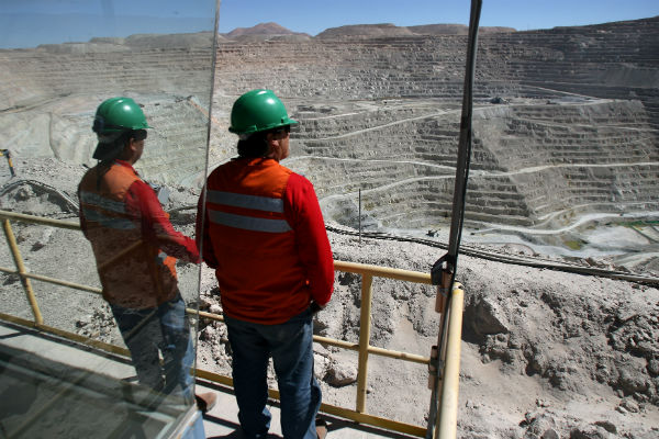 Workers at Chile's BHP copper mine strike to protest layoffs