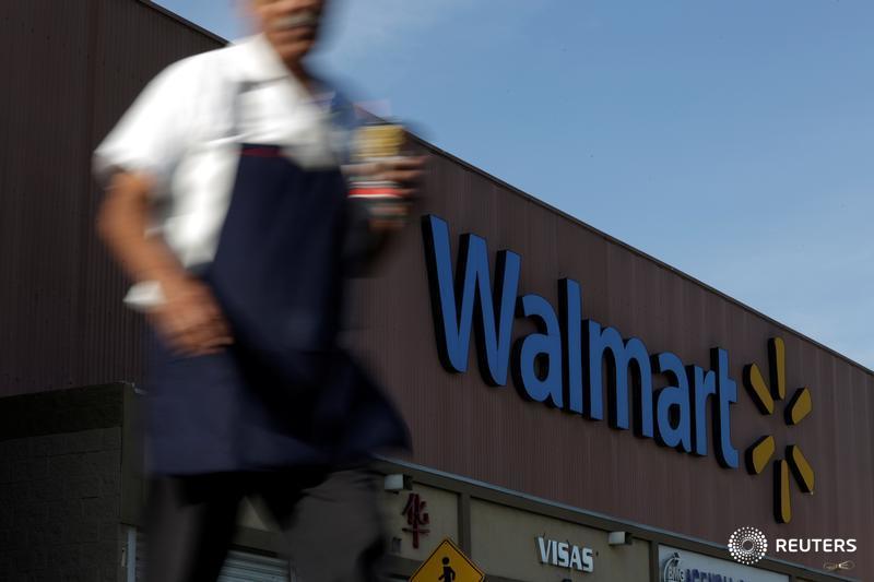 Walmart hikes minimum wage, announces layoffs on same day