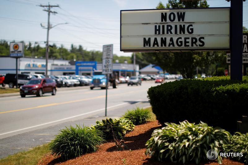 U.S. job growth surges; annual wage gain largest since 2009