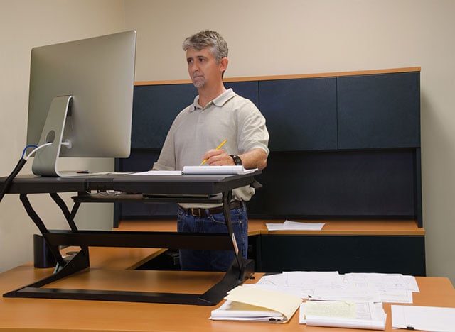 Sit-stand desks cut daily sitting time, may help engage workers: Study