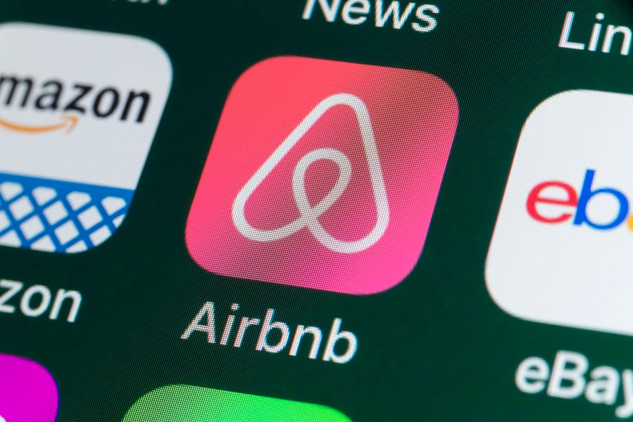 Airbnb slashes nearly 2,000 jobs, scales back investments