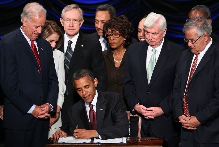 Obama signs controversial financial-reform bill - and the spin begins