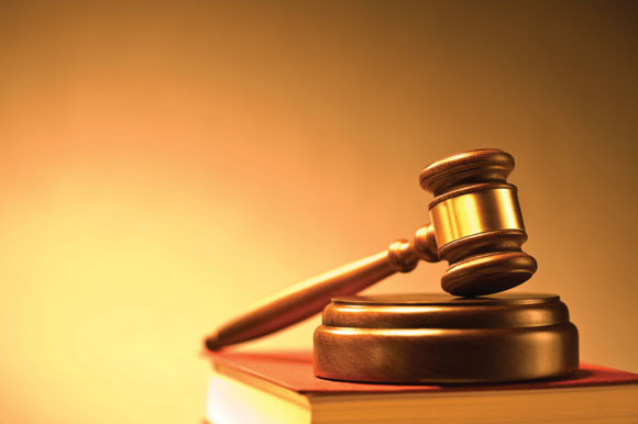 Former compliance officer sues Cabot Lodge owner