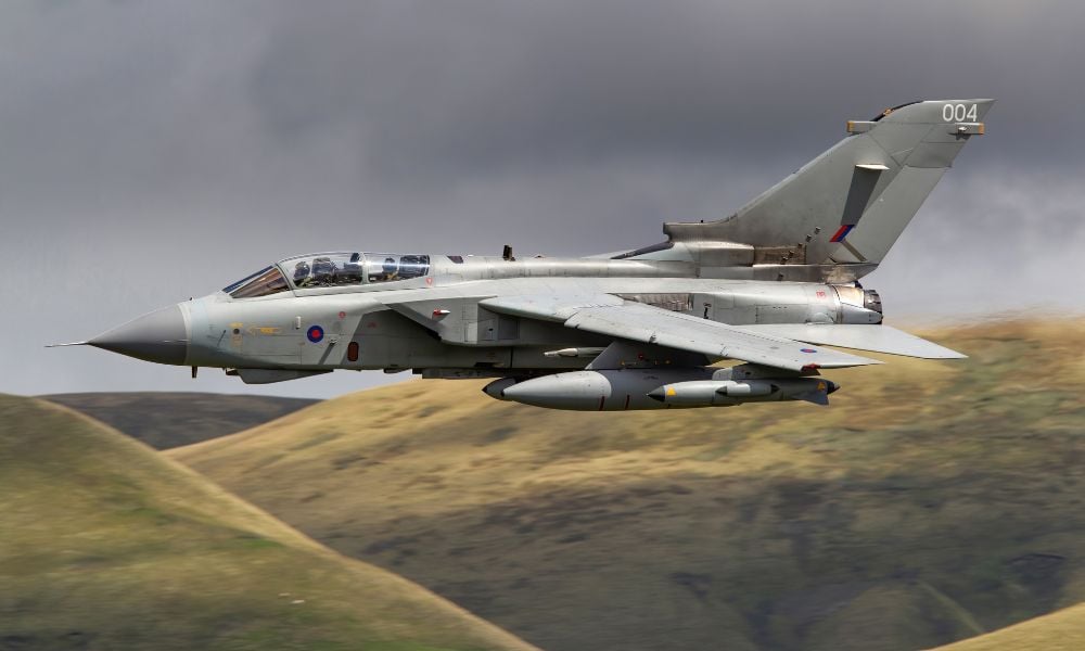 An RAF base just foiled an Iran-linked plot. A coffee shop next door is relieved she has cover