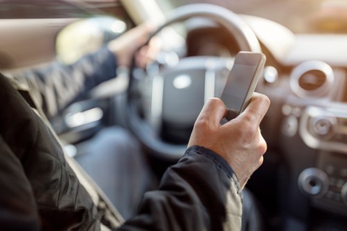 Reaching to answer that work email while driving? Think again.
