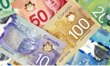 Loonie slides as markets await clarity on interest rates, US inflation data