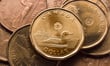 The loonie slides toward 70 cents US on a surging US dollar