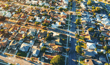 Home prices gain ground, but real value erosion drags on