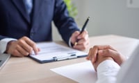 Banker says JP Morgan fired her after reporting boss to HR