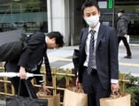 Tokyo rocked, but U.S. financial firms are staying put