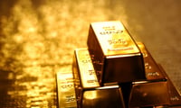 Gold slips as traders weigh smaller rate cuts