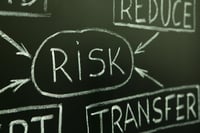 Which group is more risk averse, financial advisers or their clients?