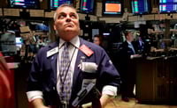 Dow closes above 11,000 for first time since May