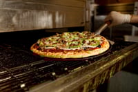 What does a pizza parlor have to do with RIAs? More than you'd think
