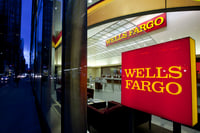 Wells Fargo has record year while Goldman's earnings collapse