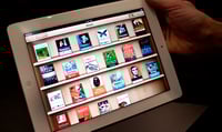 Will cash-rich Apple peel off a few bills for shareholders?