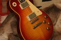 In auction of fraudsters' treasures, guitars the stars