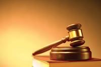 Former compliance officer sues Cabot Lodge owner