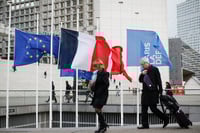 Investors pause but look past Paris attacks, keeping eye on the Fed