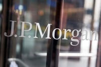 JPMorgan halts share buybacks as earnings miss estimates