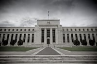 Fed raises interest rates by half point as it signals borrowing costs will head higher next year