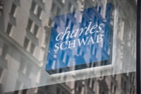 Schwab net interest revenue drops 24% as clients move cash