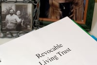 Who owns the property in a revocable trust? 