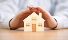 Many Hong Kong households worry more, insure less - report