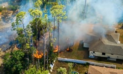 Insurers are pricing wildfire risk by the neighborhood, and the house