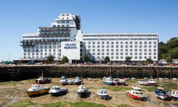 Suspected arson forces 280 evacuations at Kent hotel; insurers face a live BI test