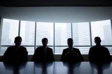 What is the difference between an underwriting agent and an insurer?