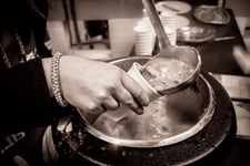 Insurance employees take time to volunteer for soup kitchen