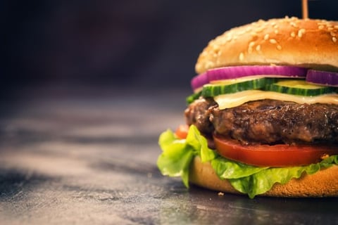 Man charged with insurance fraud after "finding" hair in burger