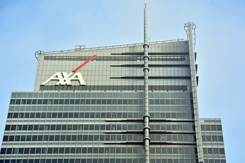 AXA shaken by 66% profit slide